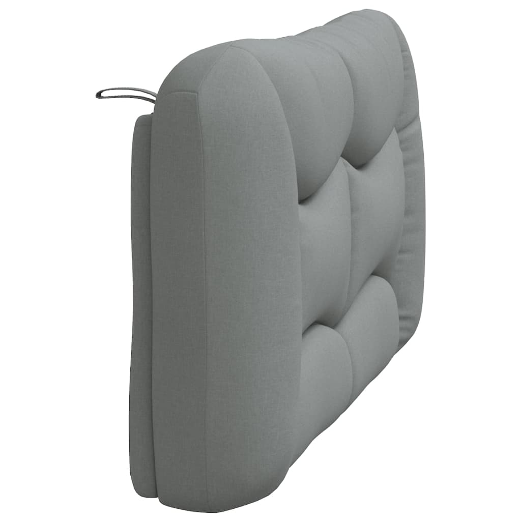 Padded gray headboard with plush tufting