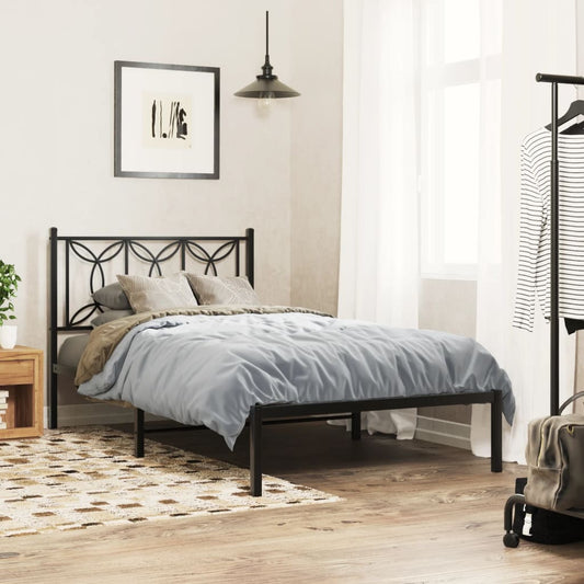 Black metal twin bed frame with decorative floral headboard