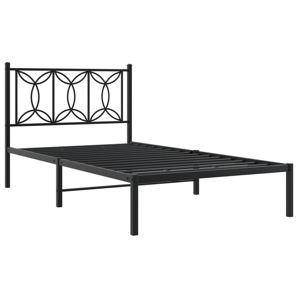 Black metal bed frame with decorative circular headboard pattern