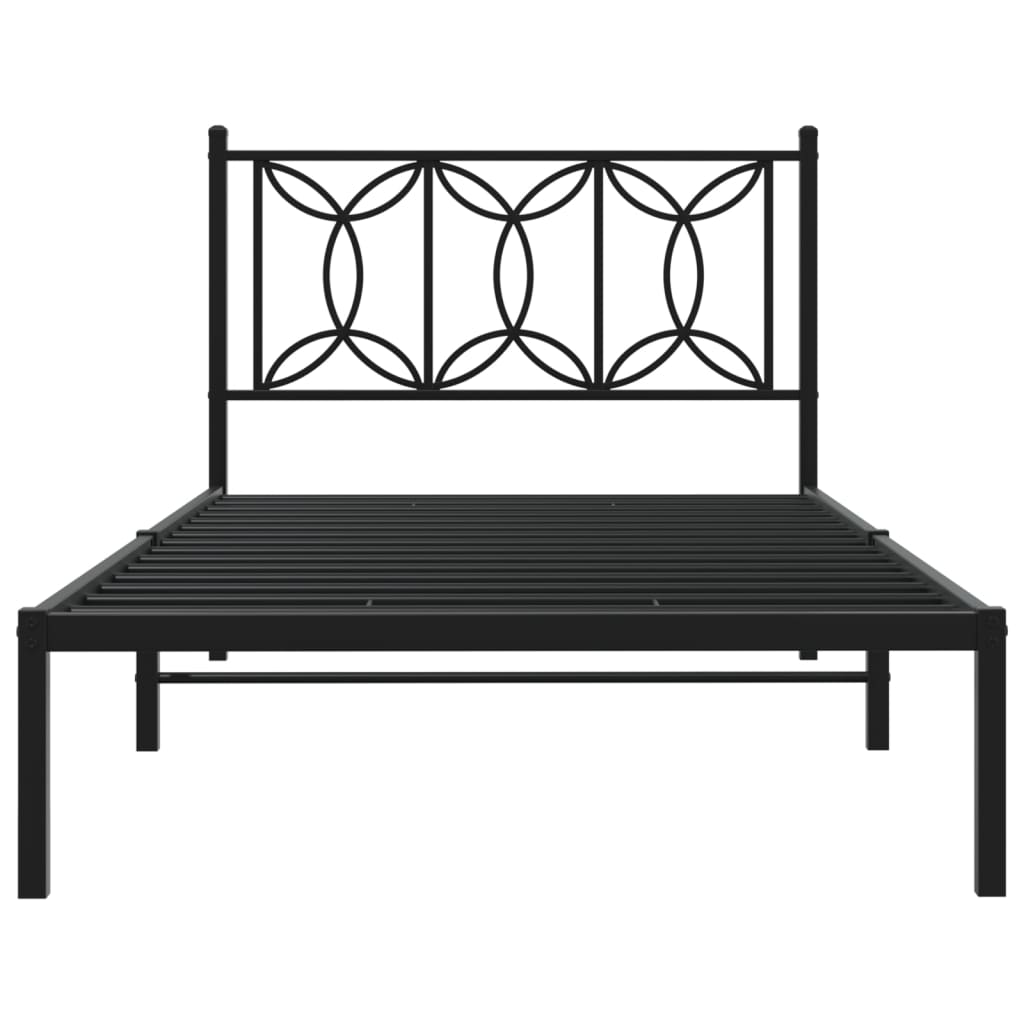 Black metal twin bed frame with decorative geometric headboard