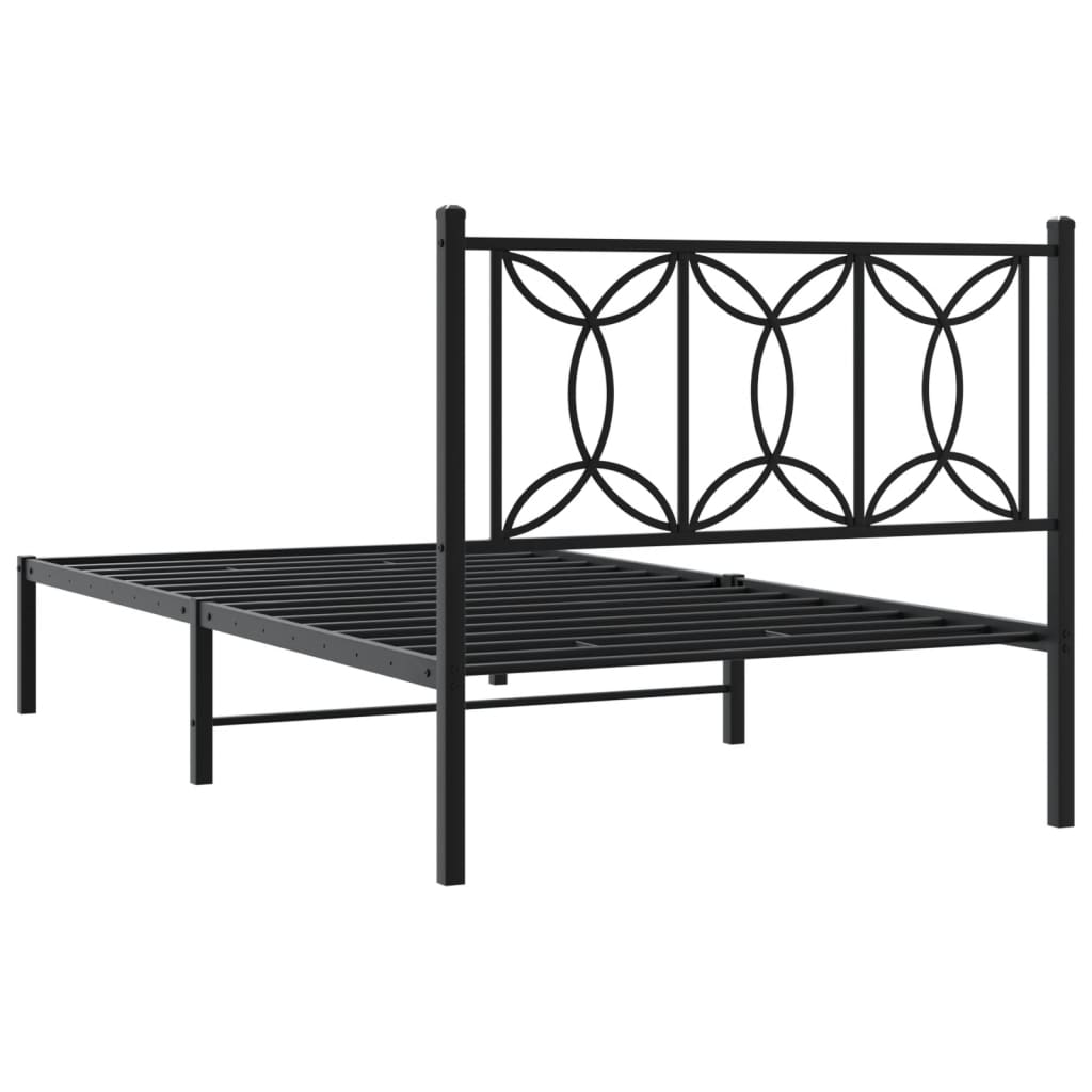 Black metal bed frame with a decorative headboard and sturdy slats