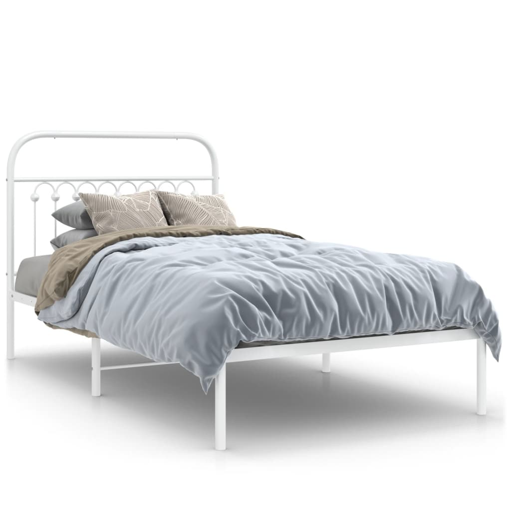White metal single bed frame with a decorative headboard and slatted base