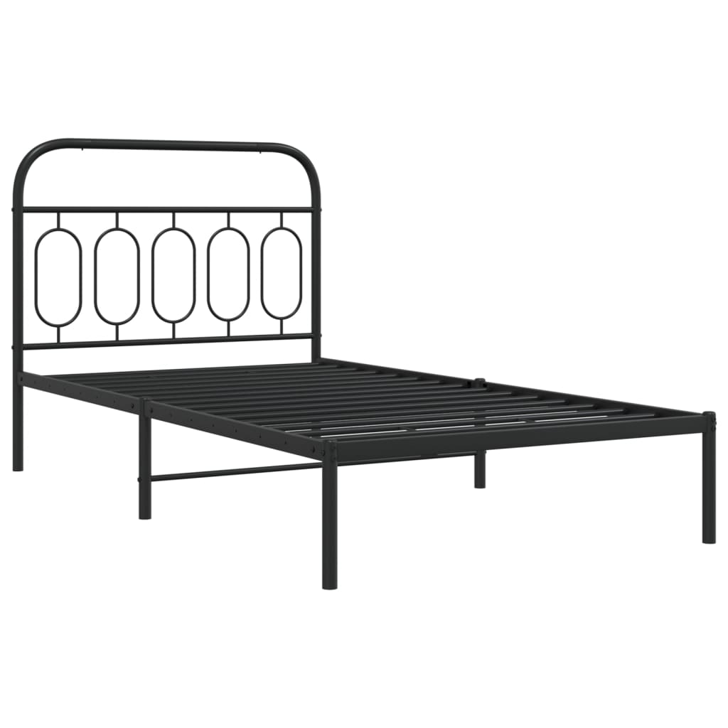 Black metal twin bed frame with curved headboard and bedding