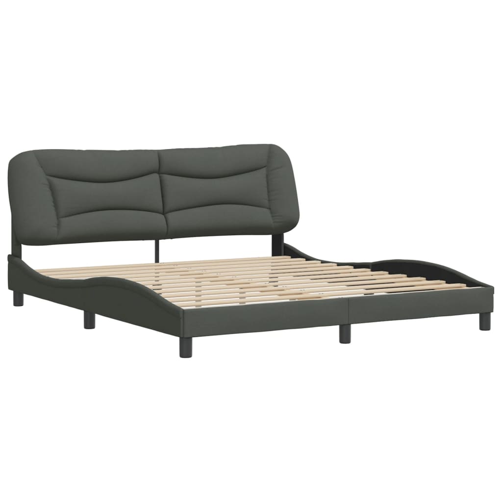 Modern dark grey fabric upholstered platform bed frame with a sculpted headboard