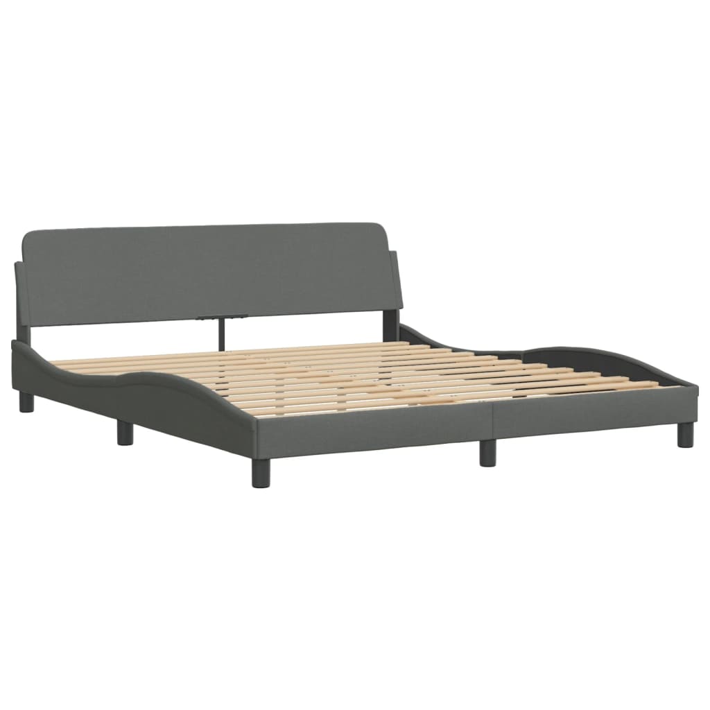 Dark grey upholstered modern bed frame with a curved tufted headboard