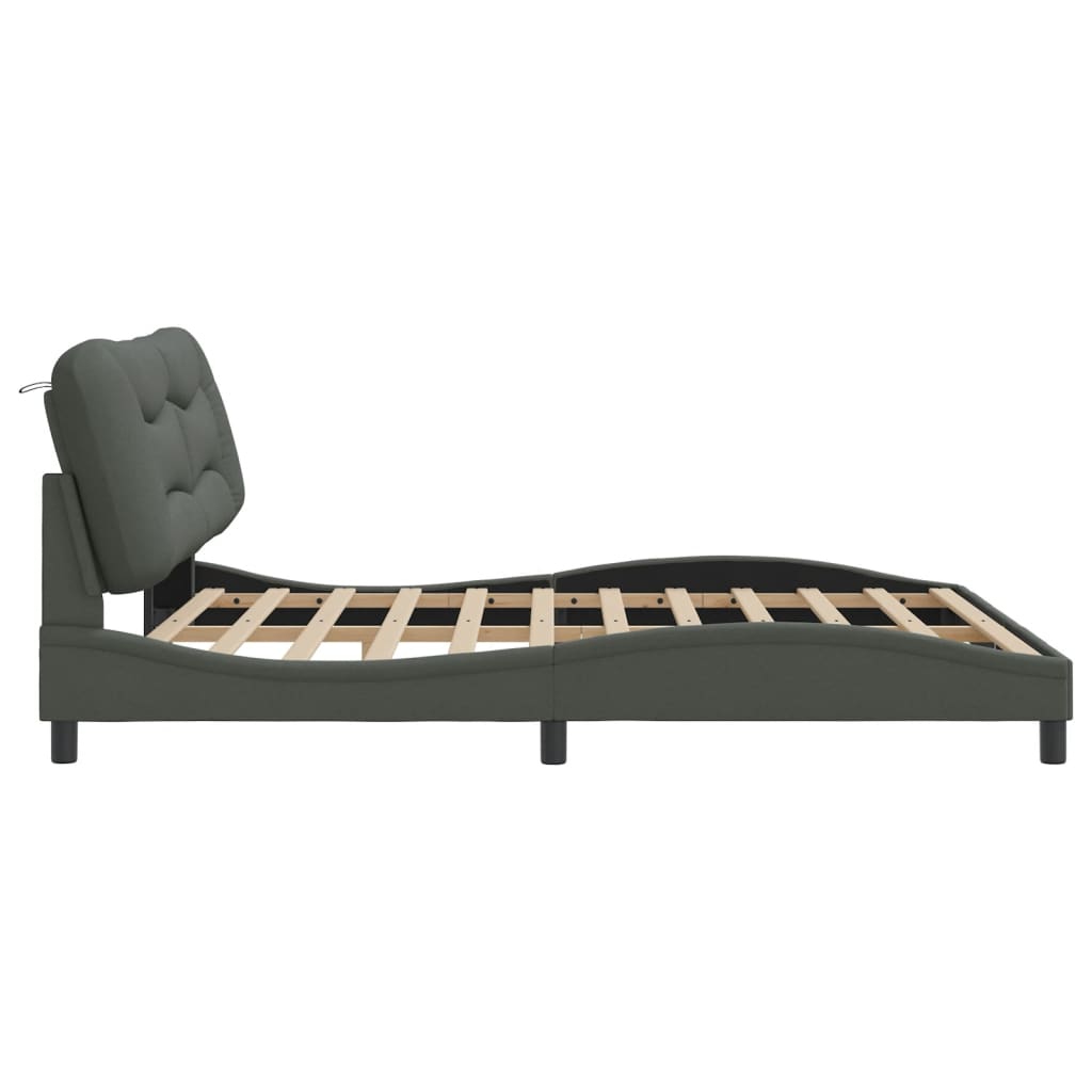 Grey fabric upholstered bed frame with curved headboard and wooden slats