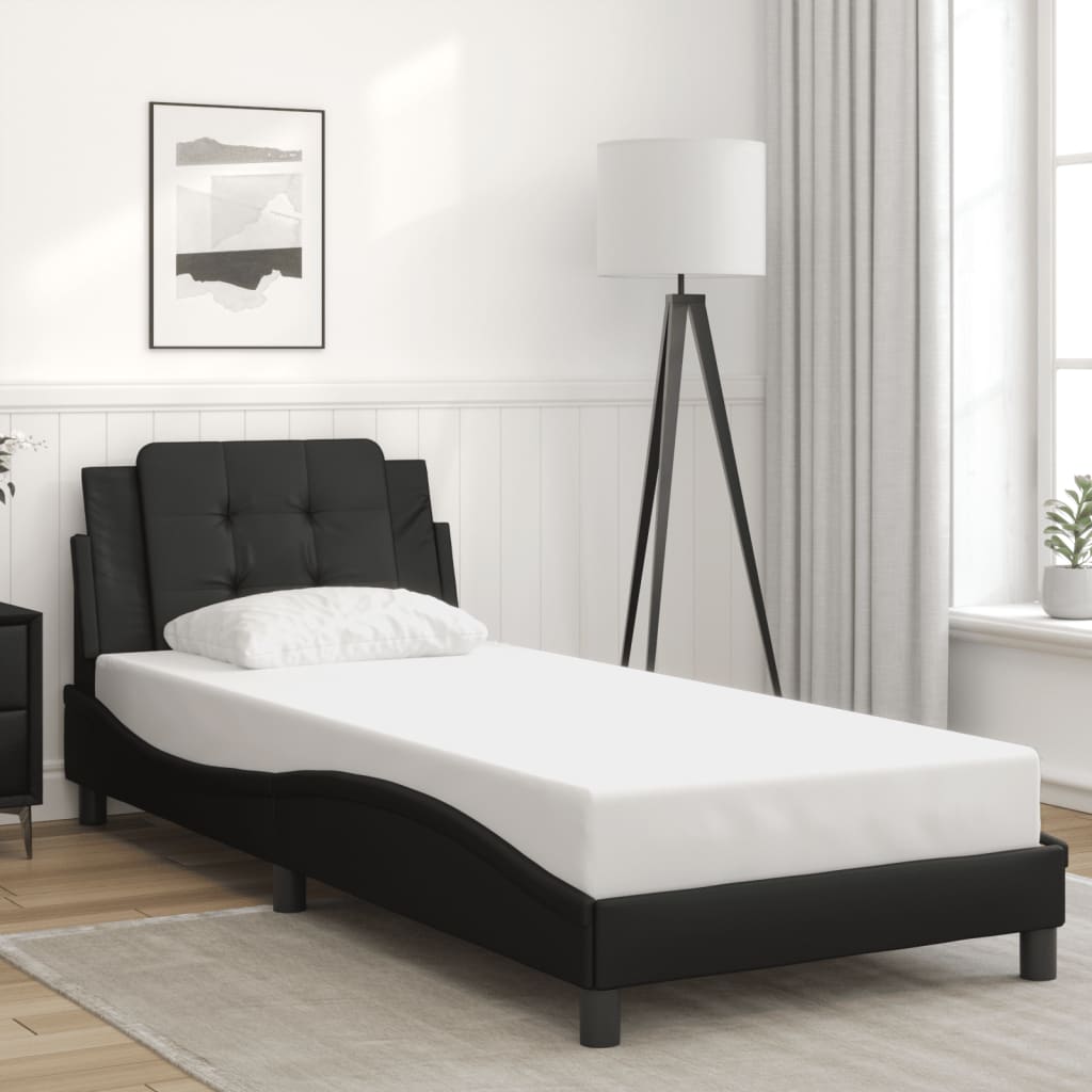Black faux leather twin bed frame with tufted headboard and white mattress