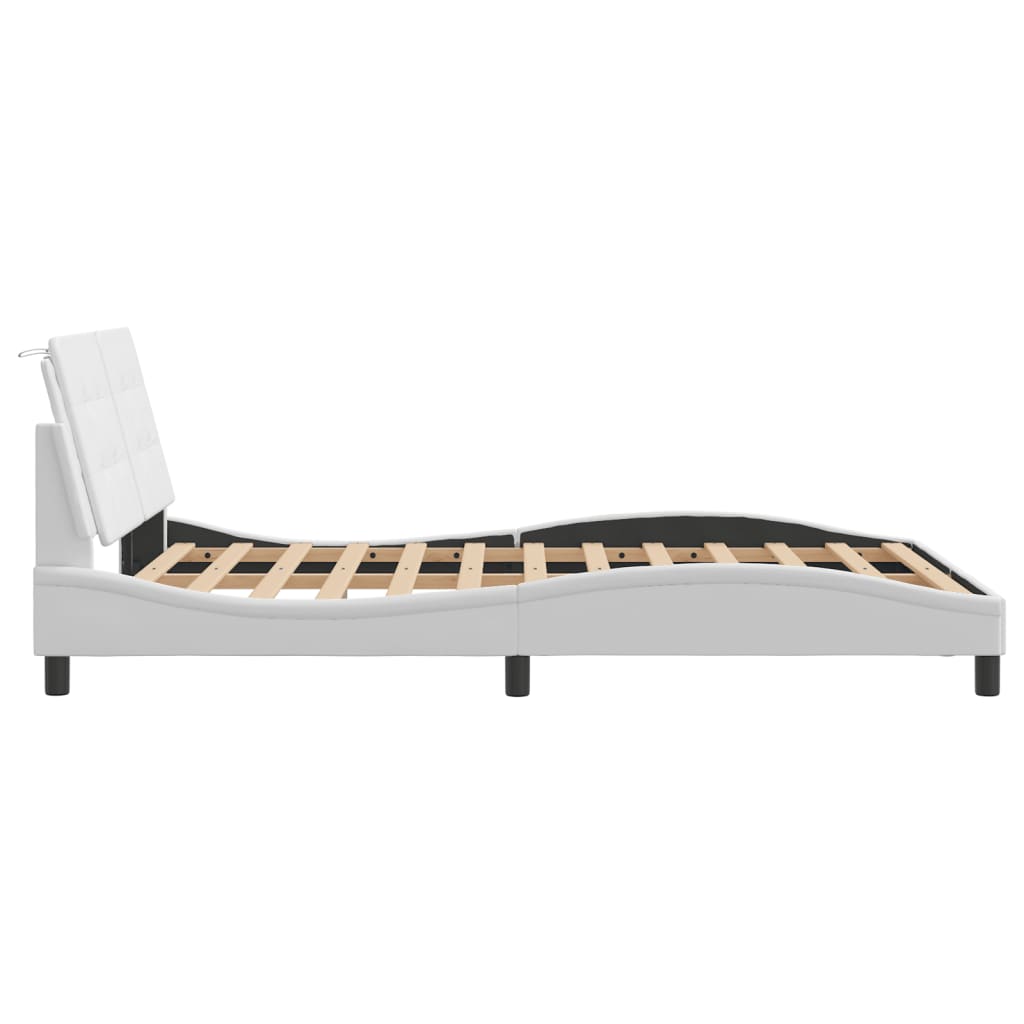 White upholstered platform bed frame with tufted headboard