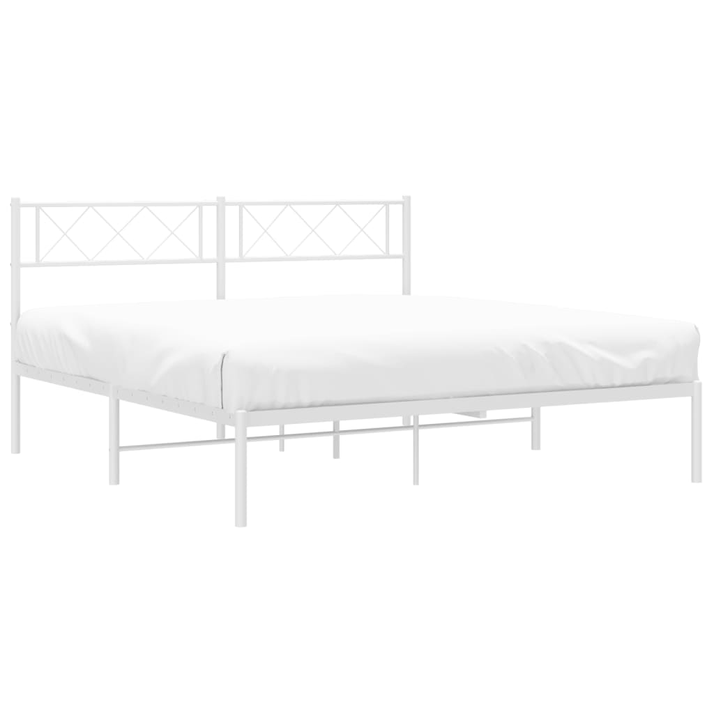 White metal bed frame with a decorative diamond pattern headboard and white mattress