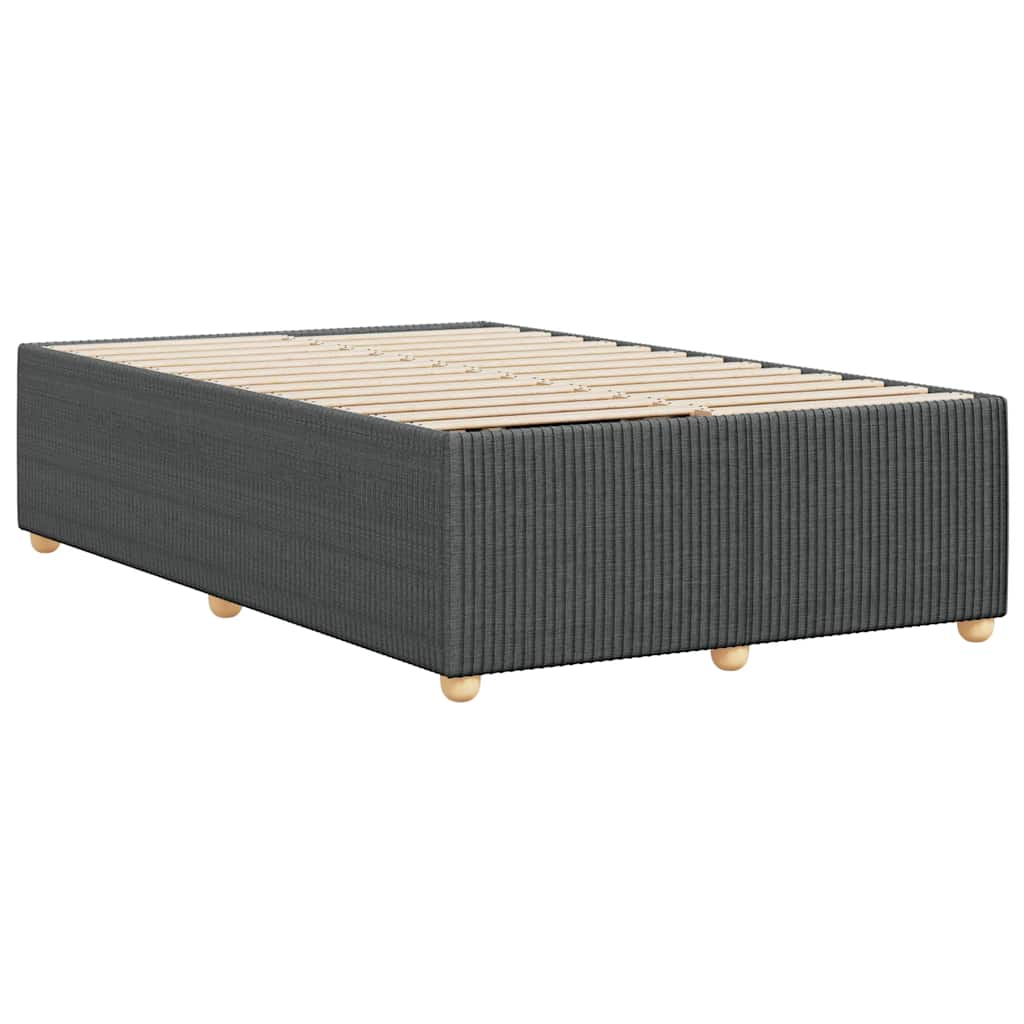 Dark grey upholstered bed base with wooden slats and round legs