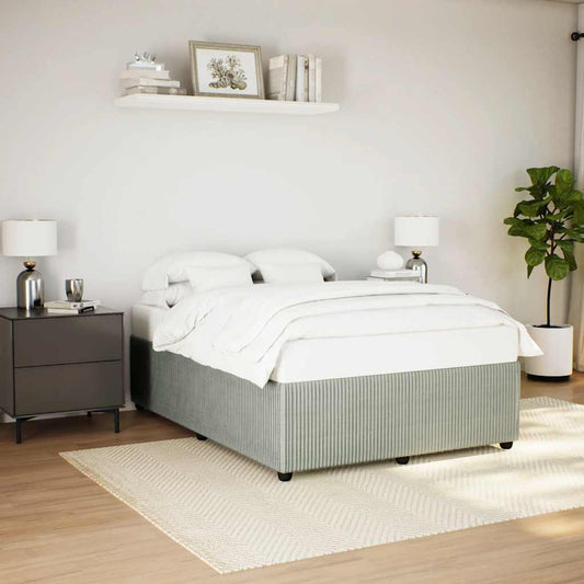 Grey pinstripe divan bed base with white bedding and grey bedside table