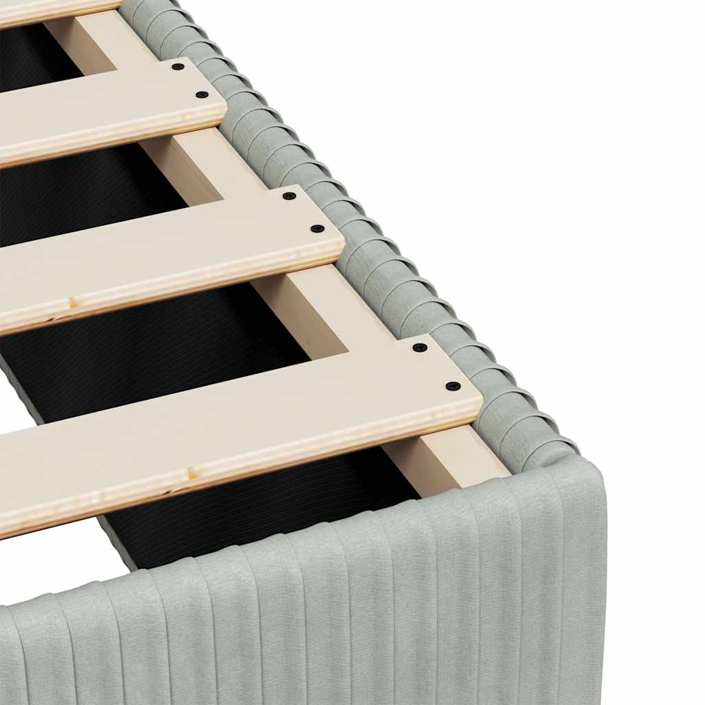 Light grey upholstered bed base with slatted wooden support