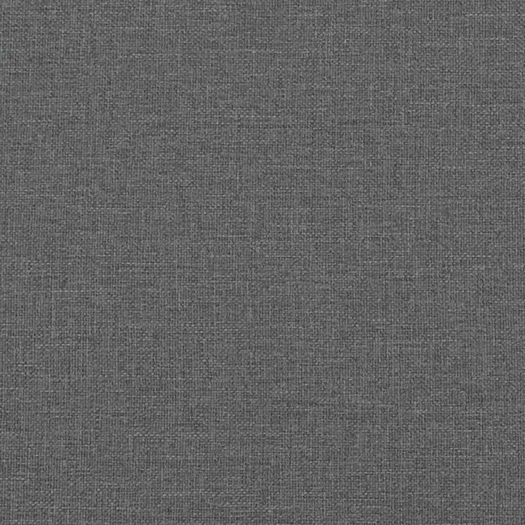 Closeup of a dark gray upholstered bed frame with wooden slats