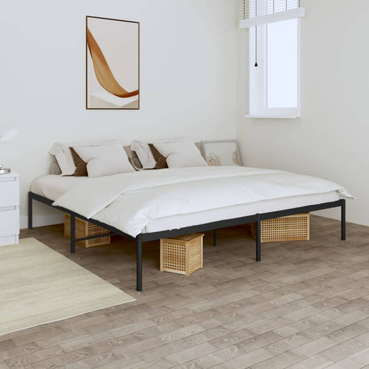 Modern black metal platform bed frame with grey bedding