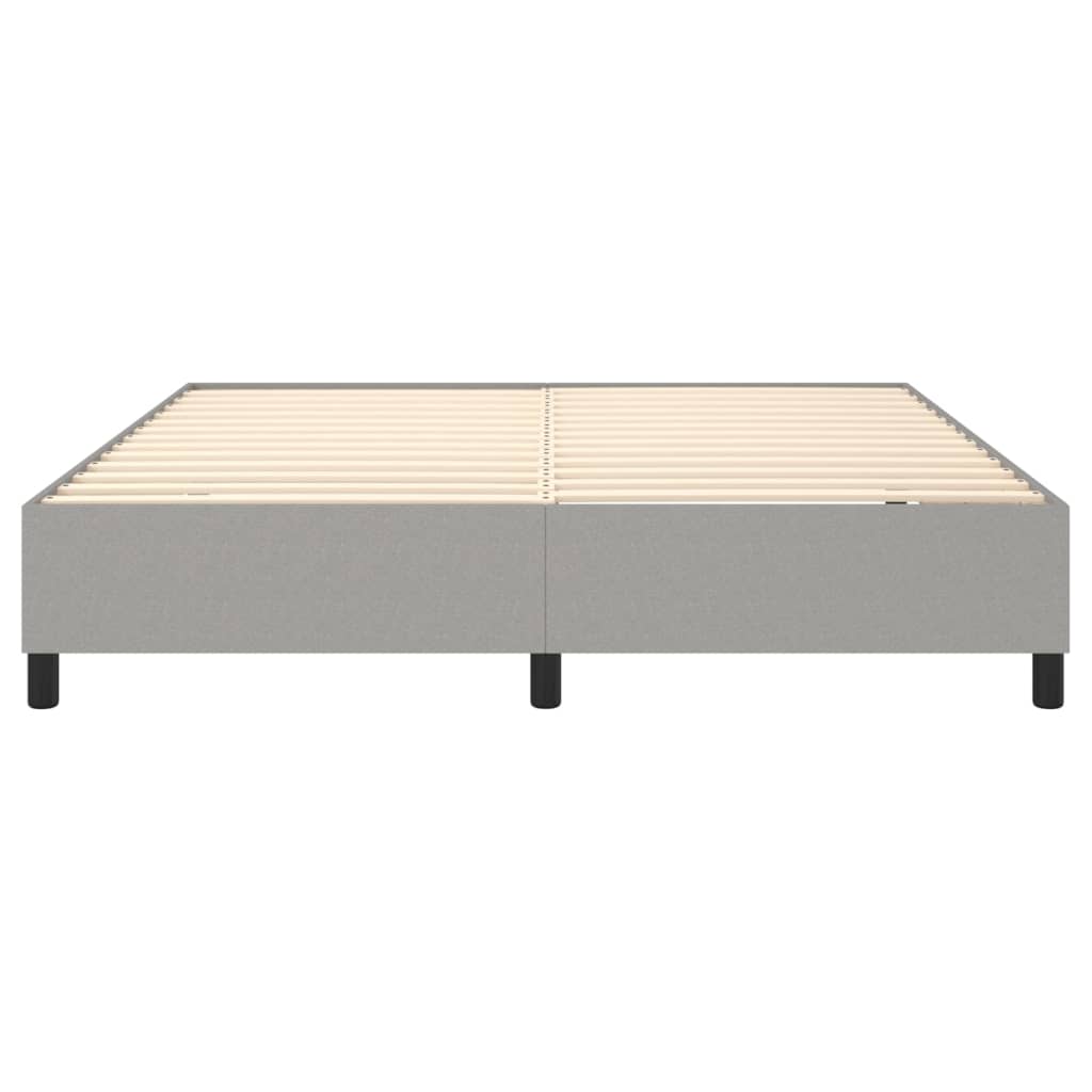 Grey upholstered platform bed frame with wooden slats