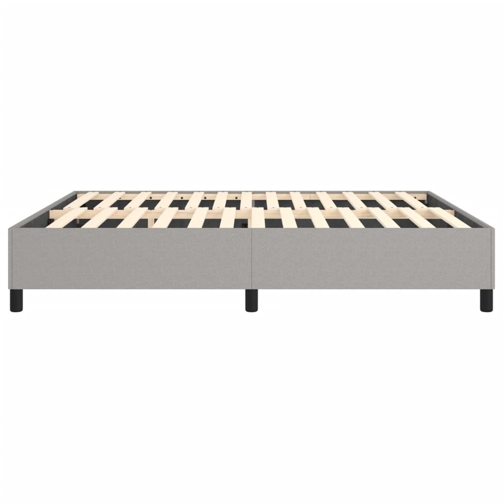 Grey upholstered bed frame with wooden slats and black legs
