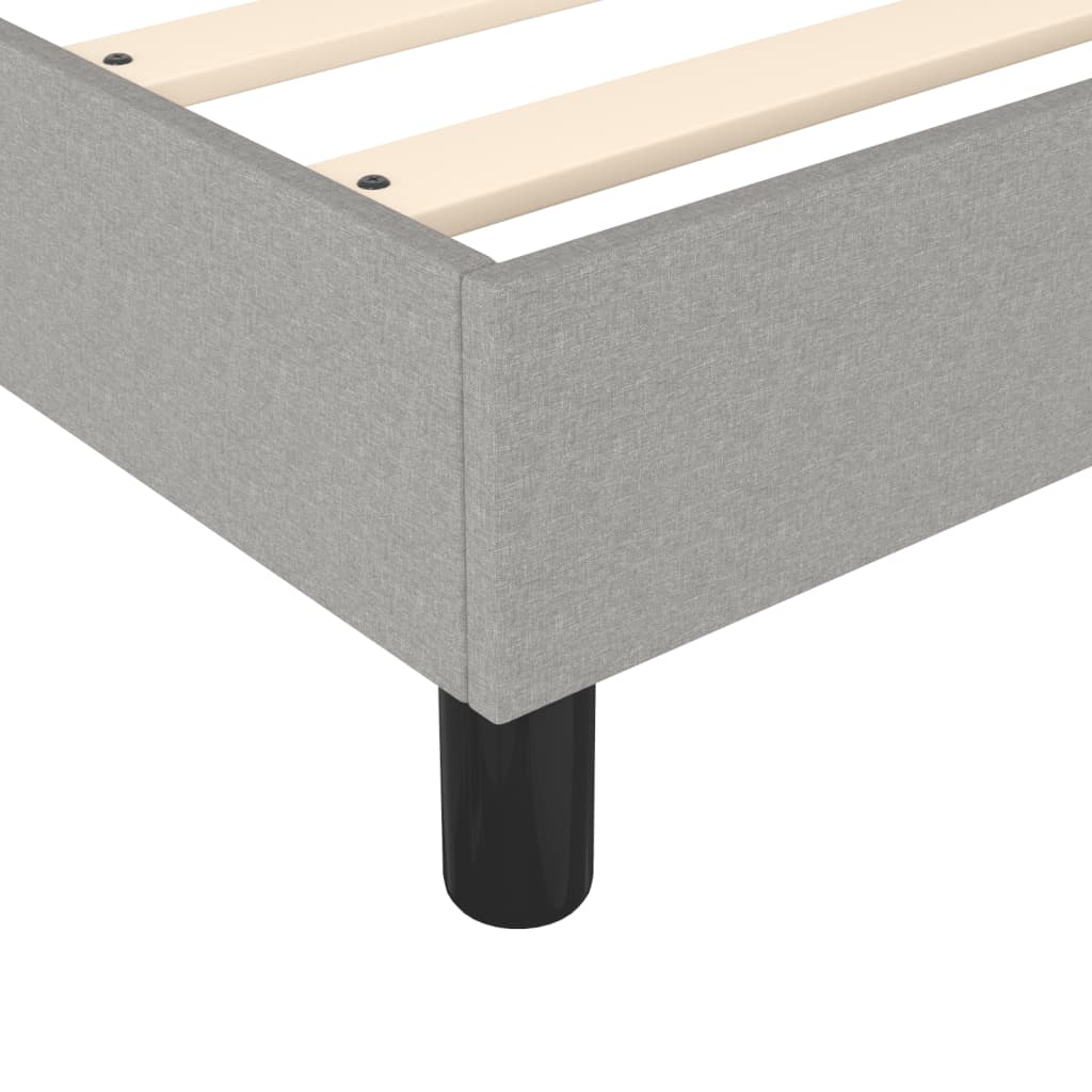 Grey upholstered platform bed frame with wooden slats