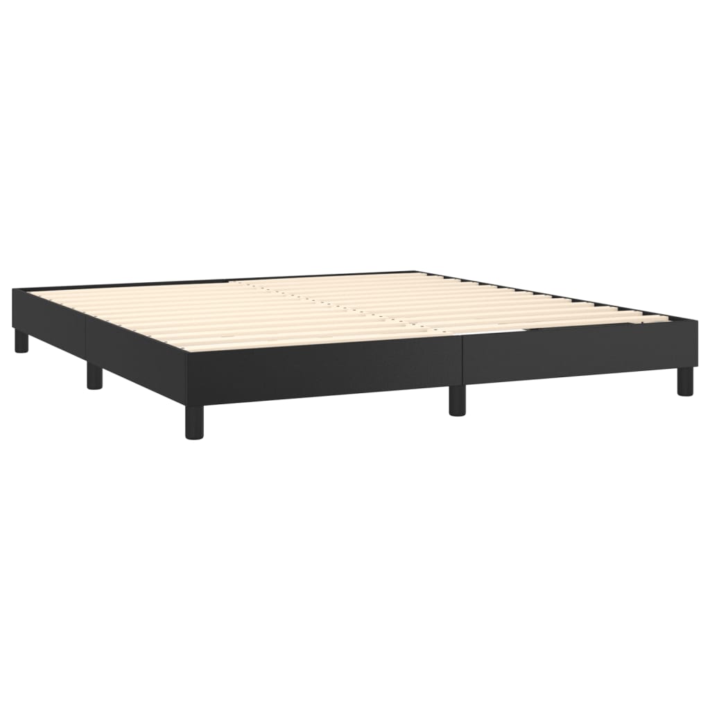 Modern black bed frame with white mattress