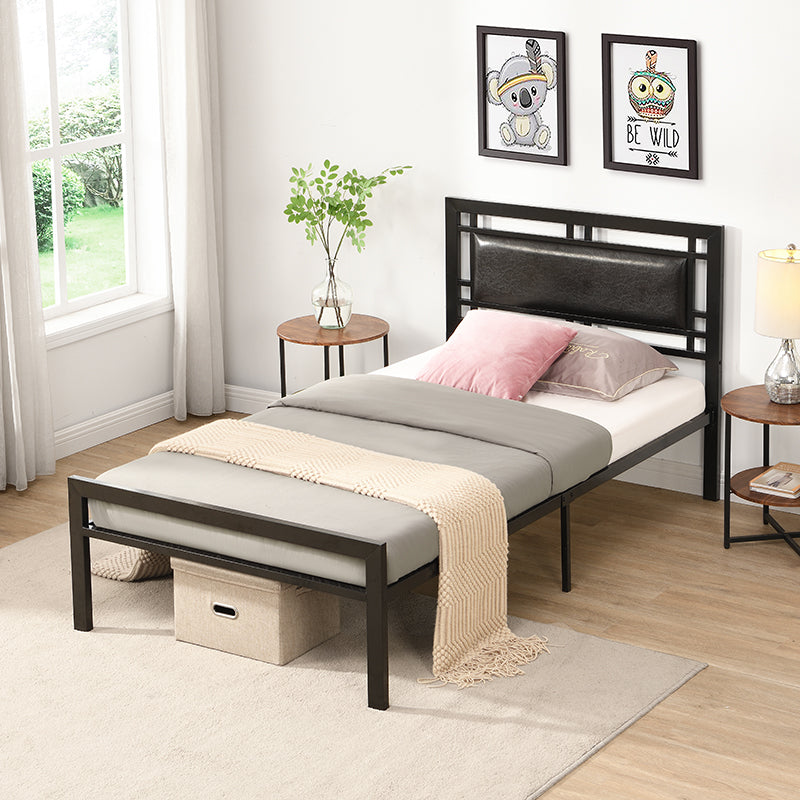 Black metal twin bed frame with faux leather headboard and beige blanket