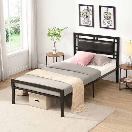 Black metal twin bed frame with faux leather headboard and beige blanket