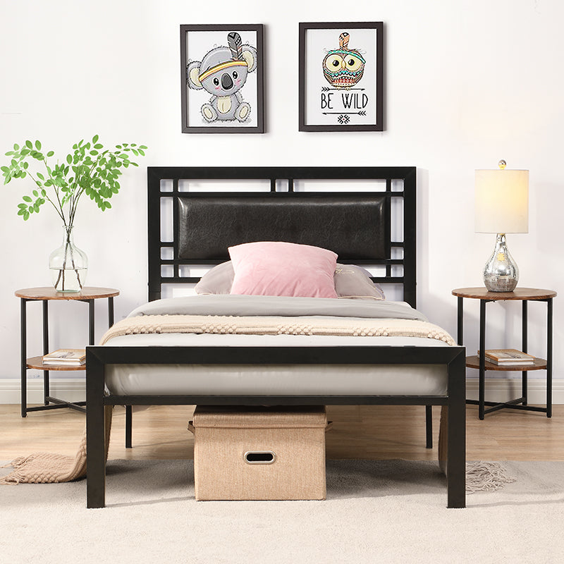 Black metal bed frame with upholstered headboard and bedding