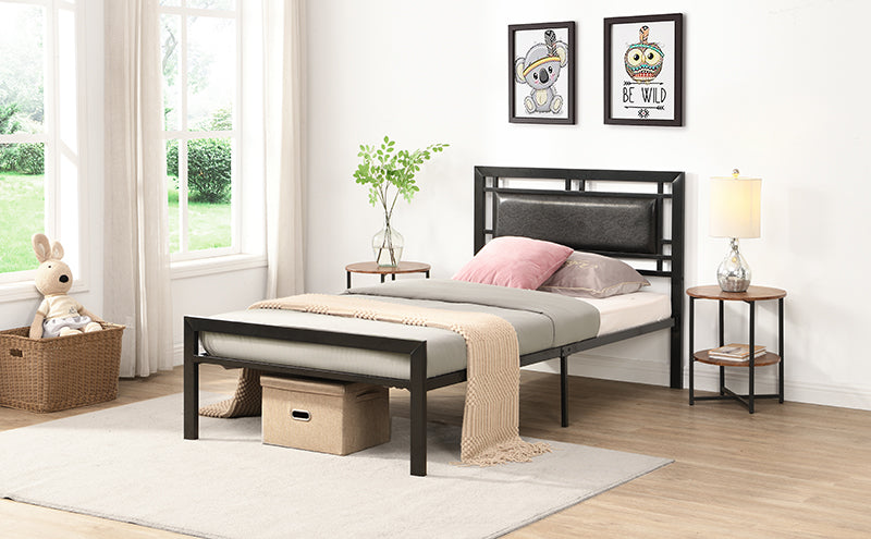 Black metal twin bed frame with padded headboard and mattress