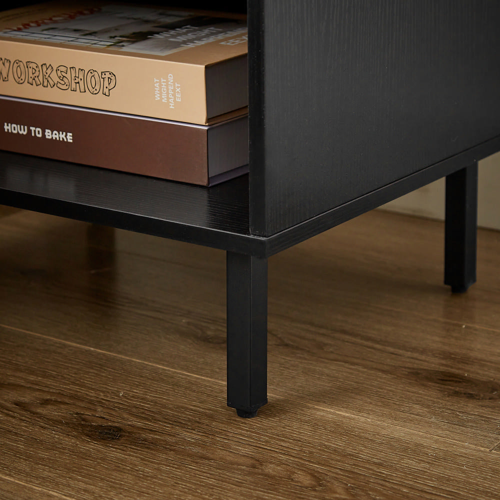 Black metal media console legs on hardwood floor