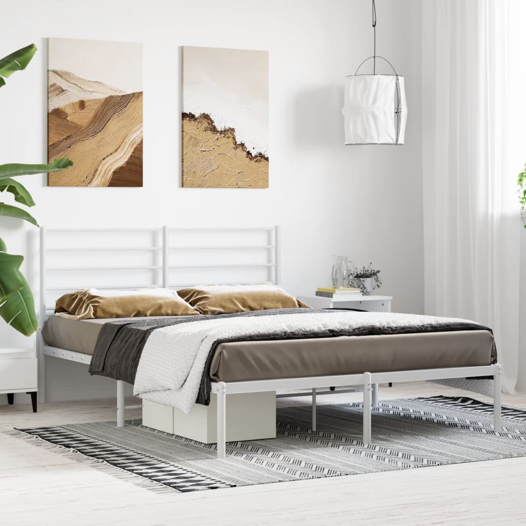 White metal bed frame with minimalist headboard queen size styled with linens and side tables