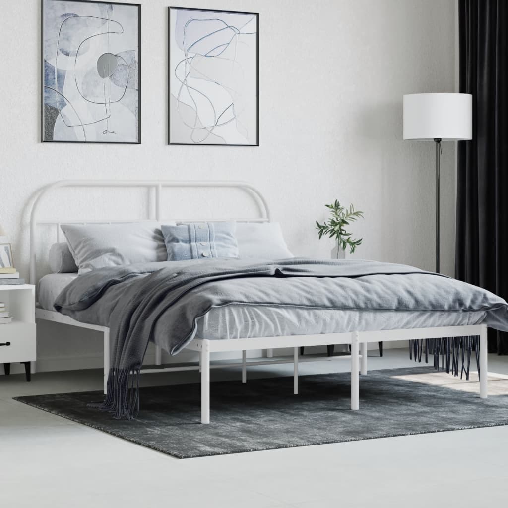 White metal bed frame with arched headboard and slatted support