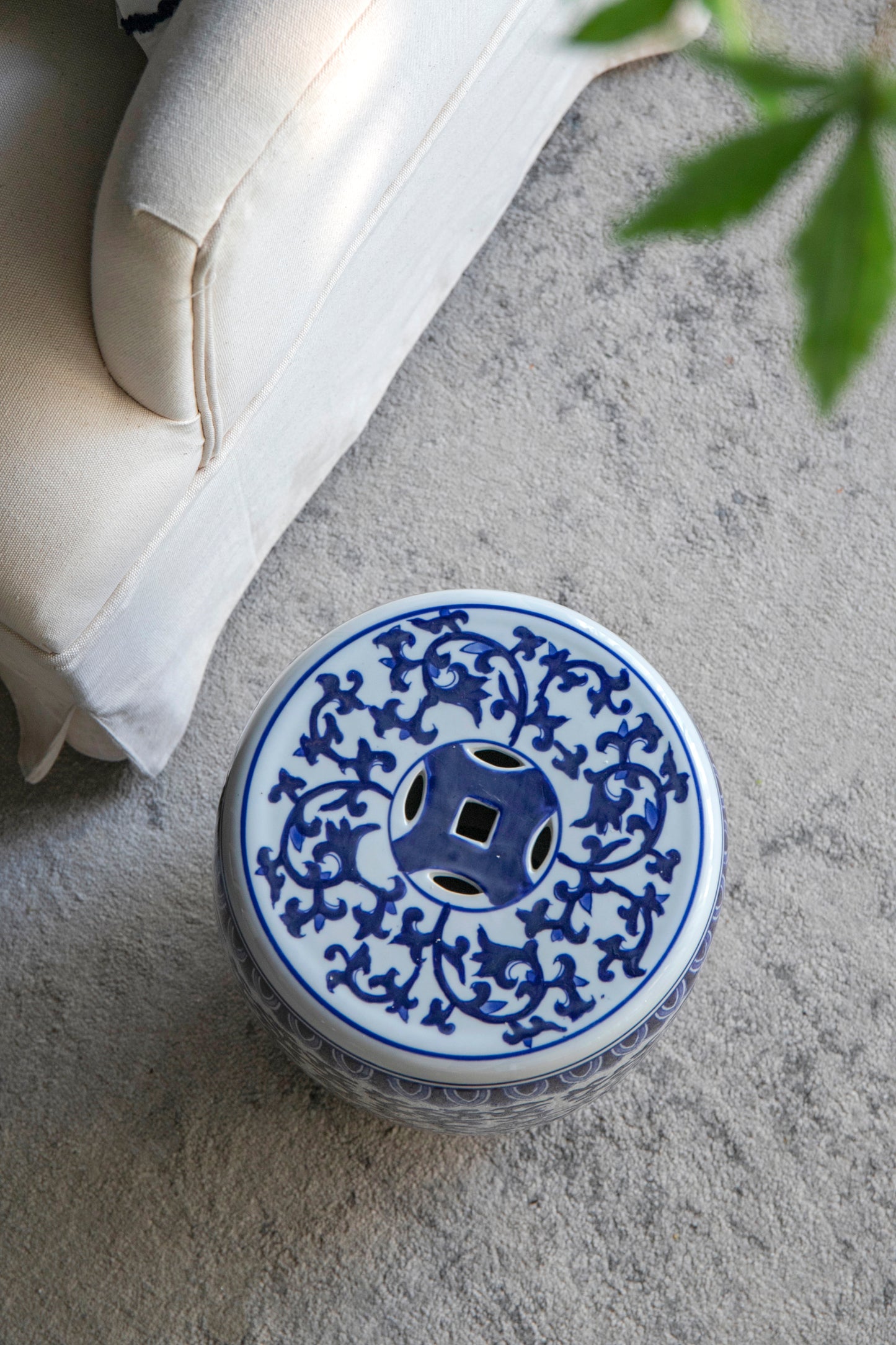 Blue and white ceramic garden stool with intricate floral pattern