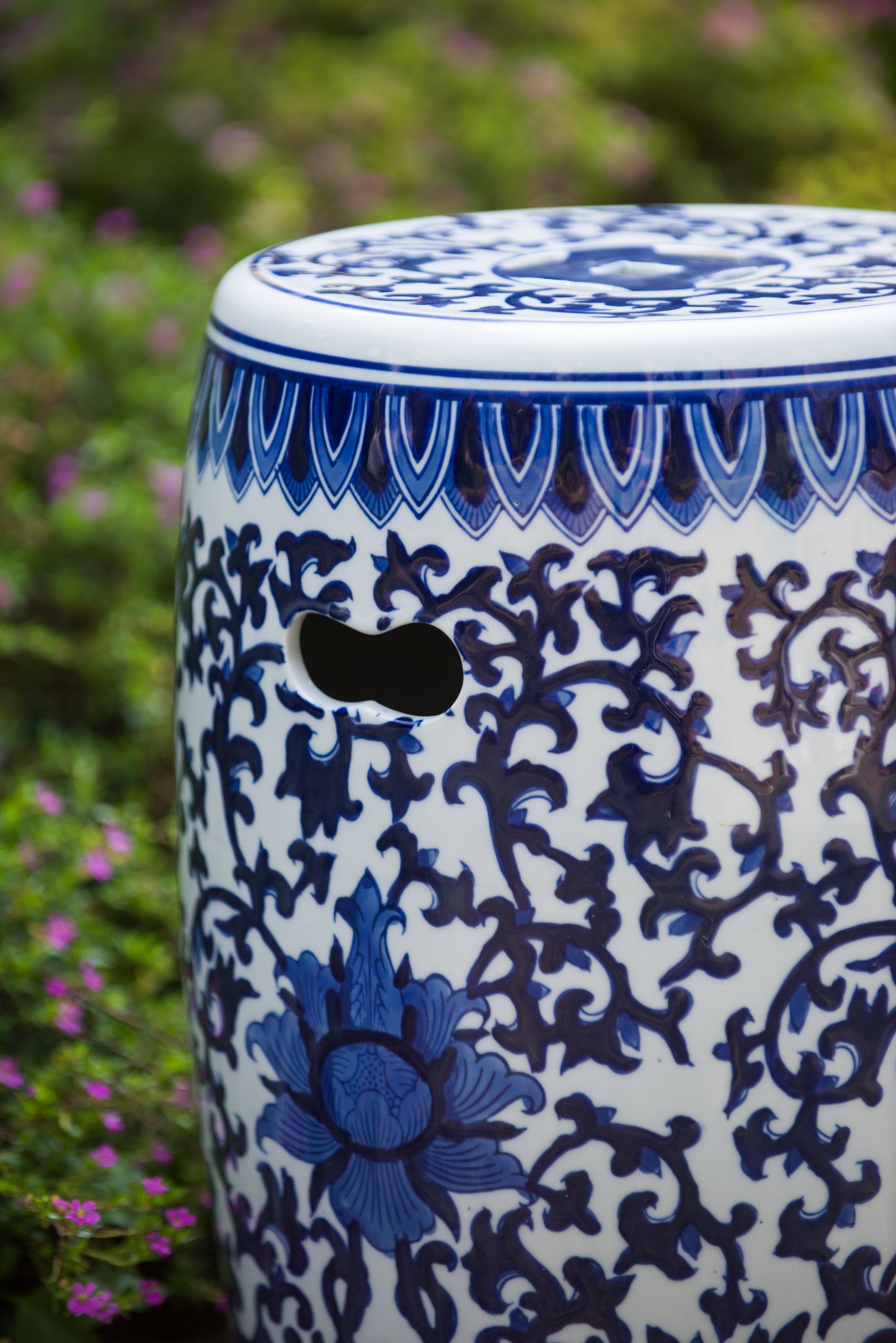 Blue and white ceramic garden stool with ornate floral pattern