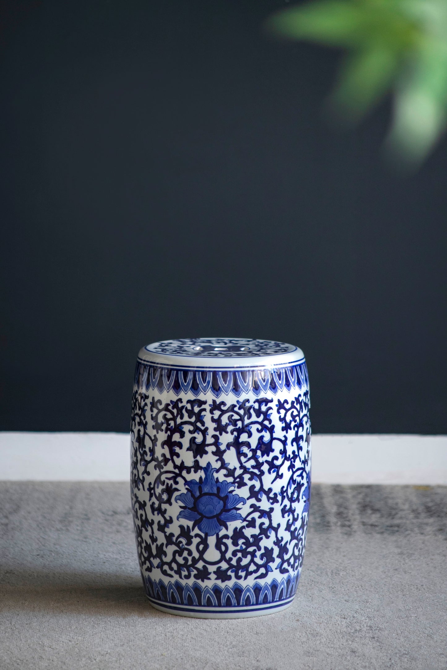 Blue and white ceramic garden stool with floral pattern