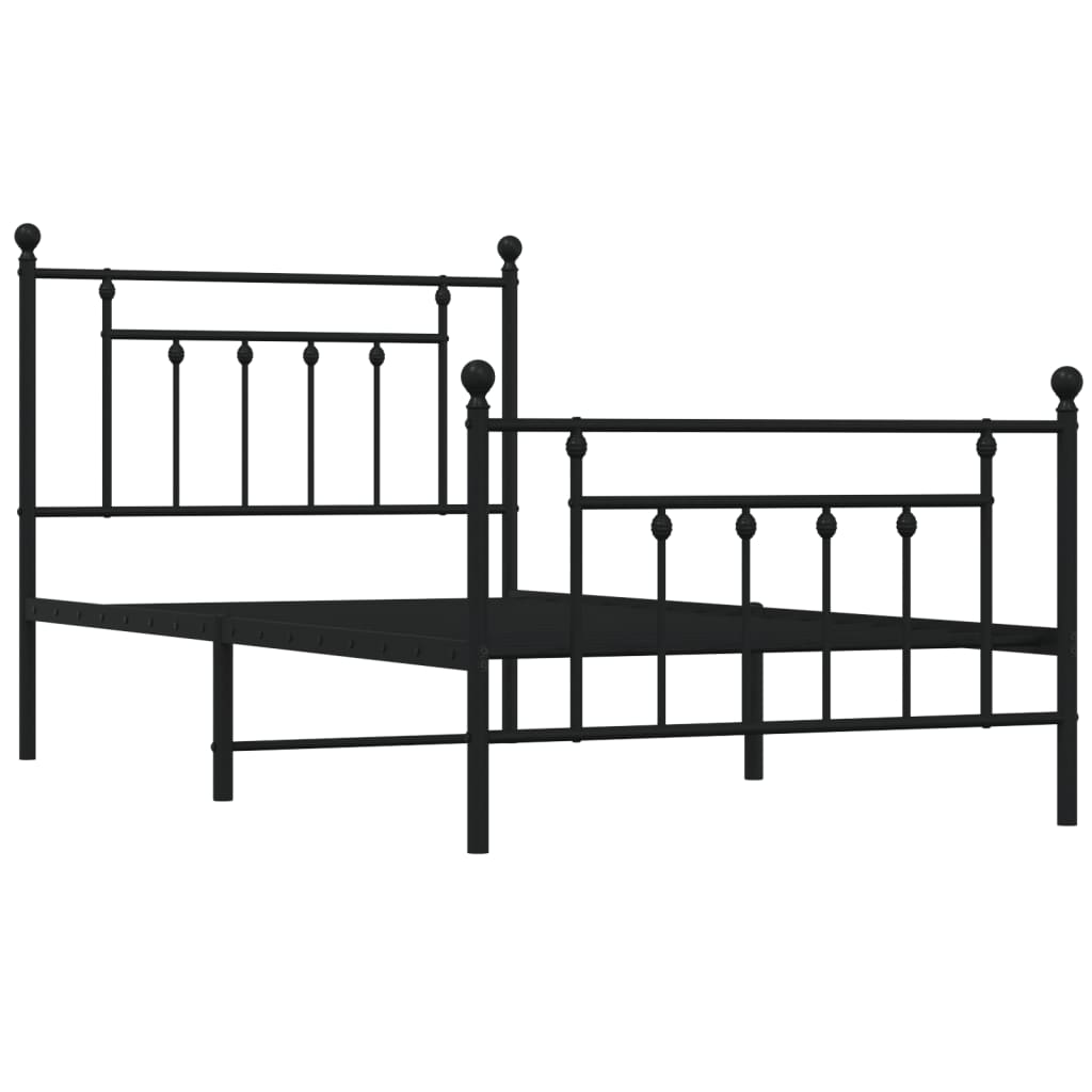 Classic black metal bed frame with ornamental finials and a white mattress