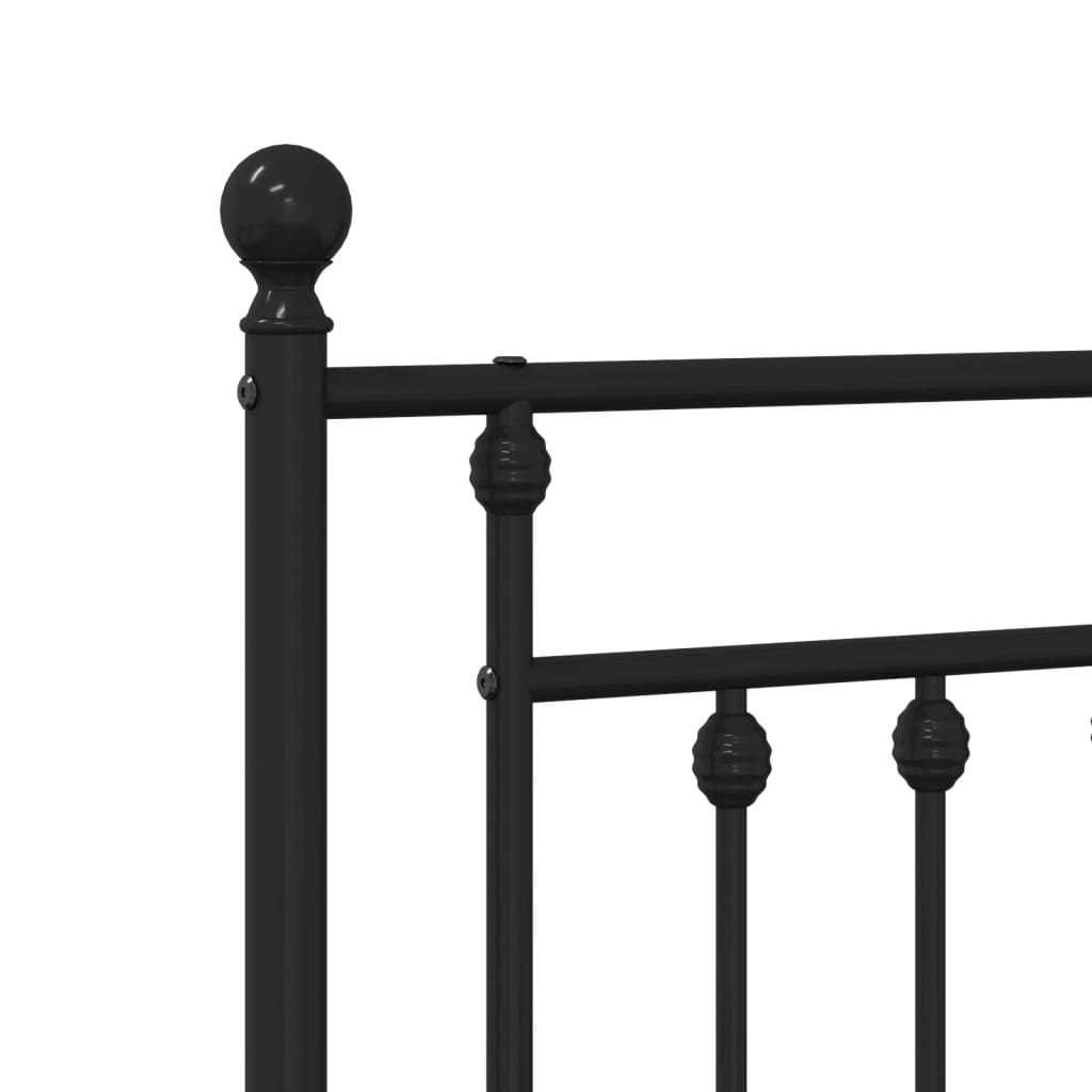 Black metal bed frame with ornate headboard and footboard