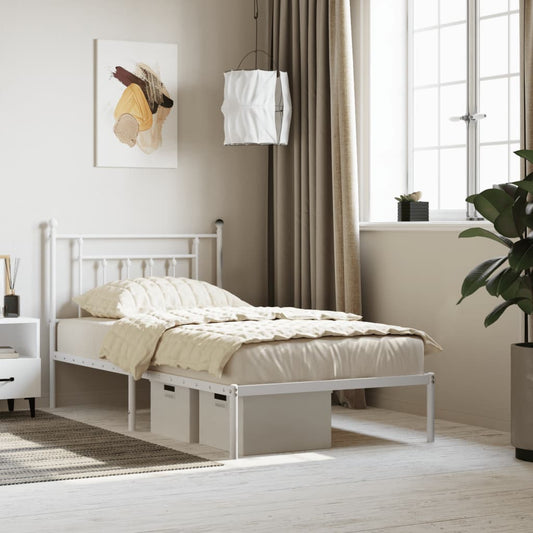 White metal twin bed frame with decorative headboard and footboard