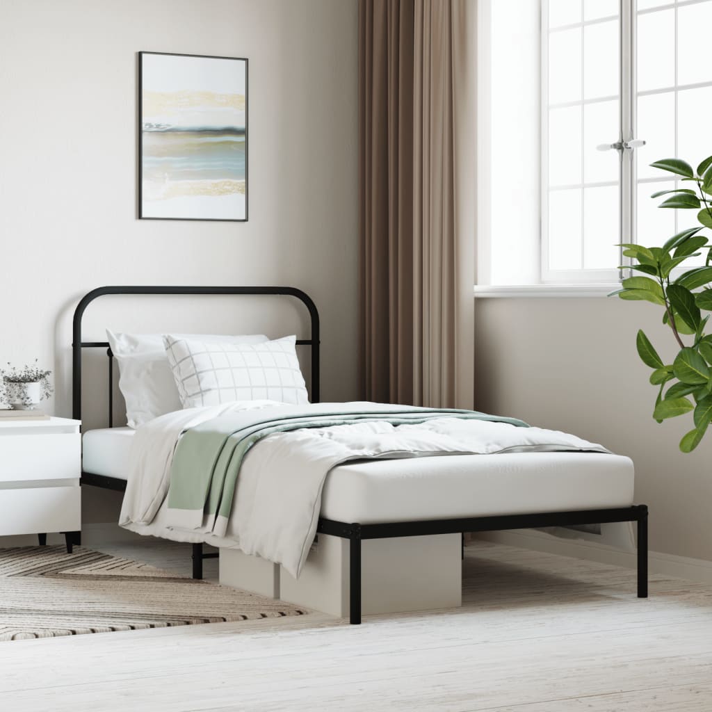 Black metal twin bed frame with decorative headboard and footboard