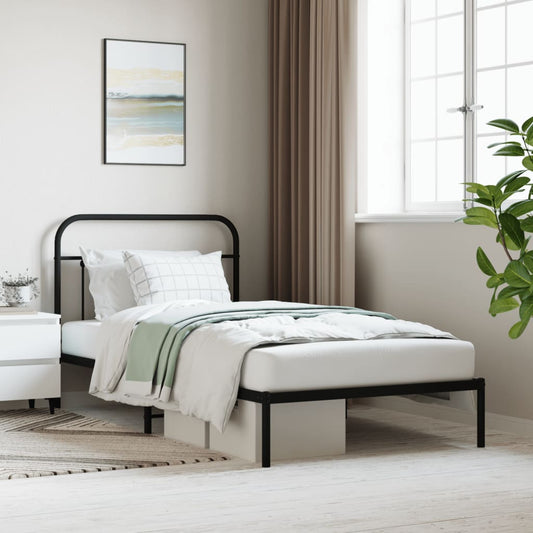 Black metal twin bed frame with decorative headboard and footboard