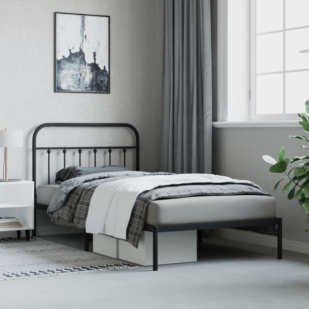 Black metal twin bed frame with arched headboard and footboard