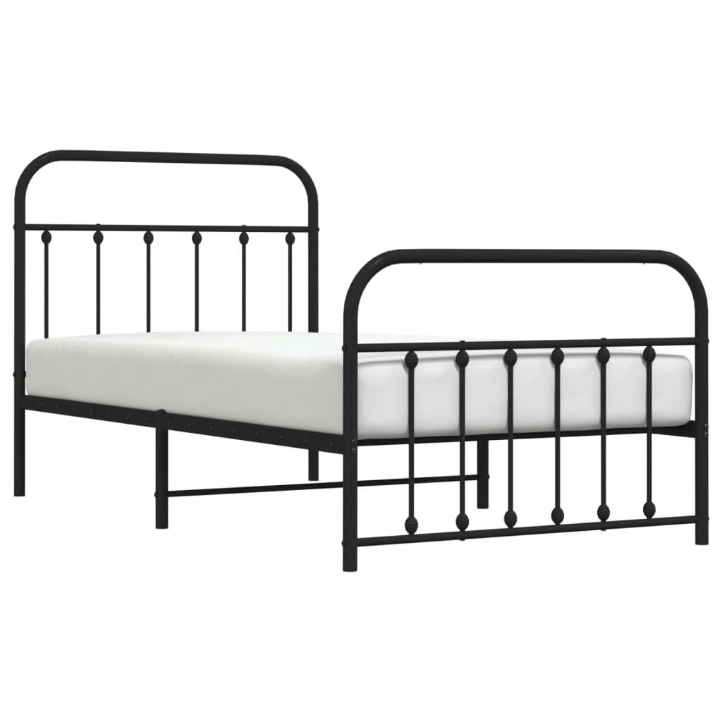 Black metal twin bed frame with ornate headboard and footboard