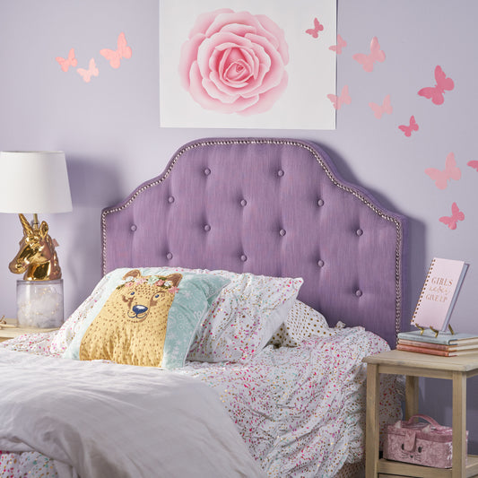 Tufted lavender upholstered headboard with silver nailhead trim