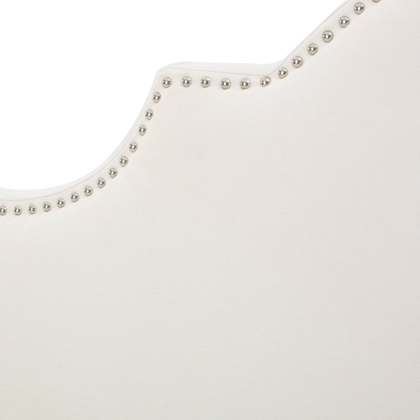 Cream fabric headboard with silver nailhead trim details