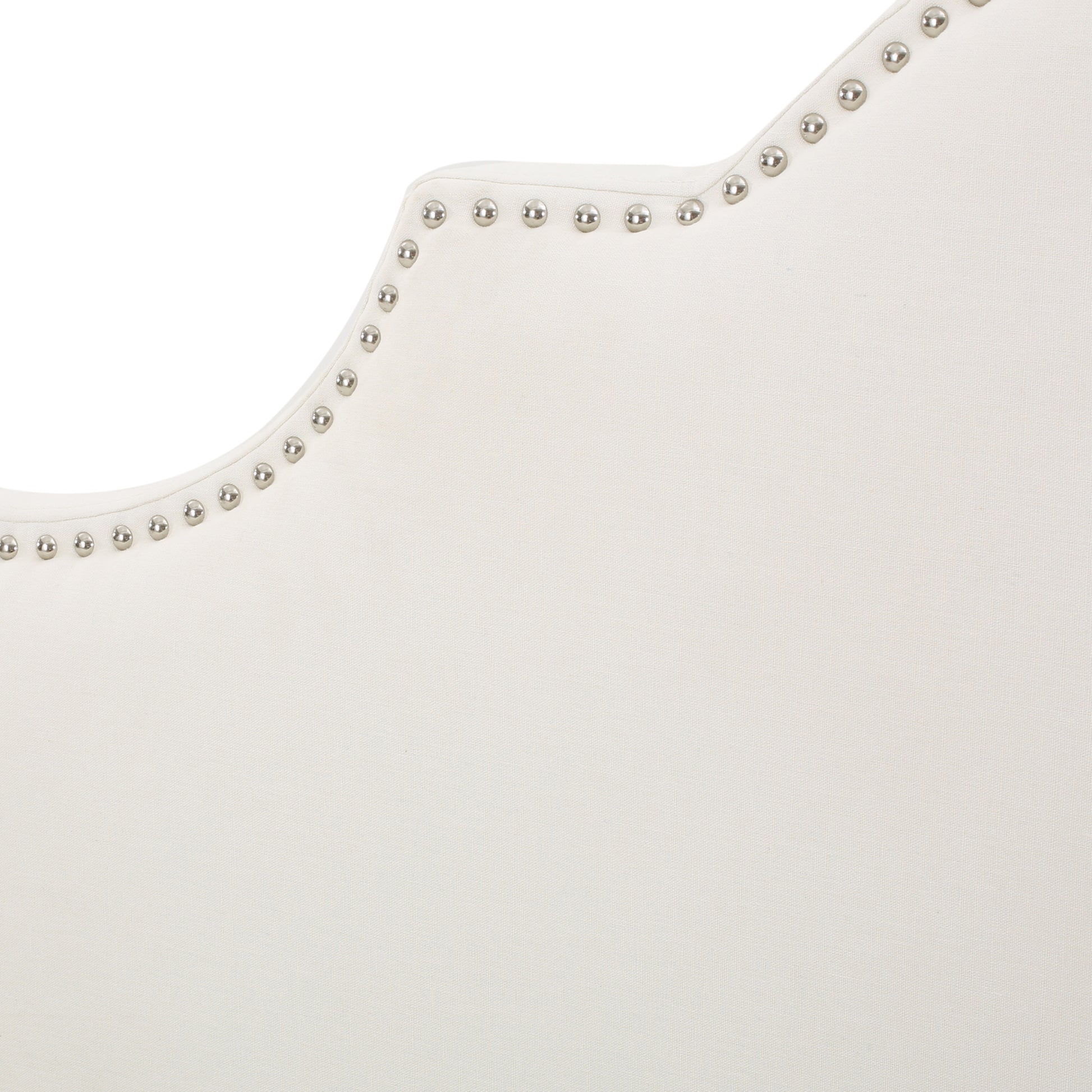 Cream fabric headboard with silver nailhead trim details