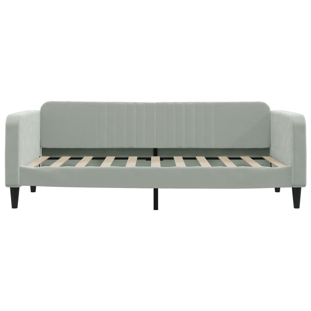 Light gray velvet daybed with channel tufted back and slatted frame