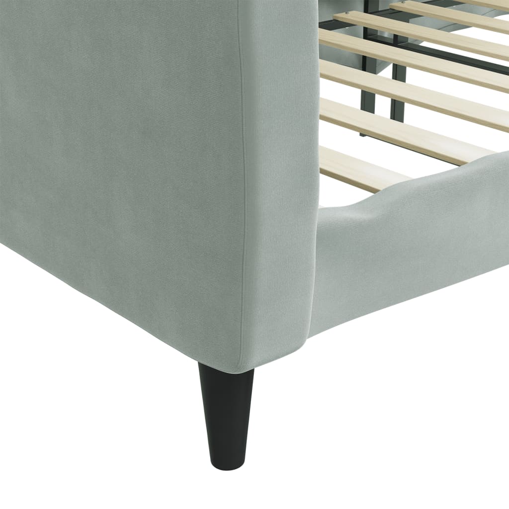 Light gray upholstered sofa viewed from the back with black legs