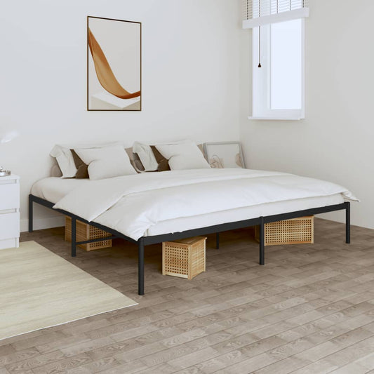 Minimalist black metal bed frame with upholstered headboard and grey bedding