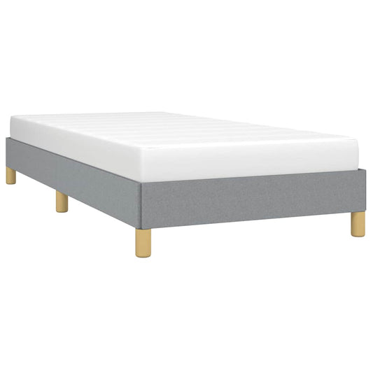 Modern grey upholstered twin bed with wooden legs
