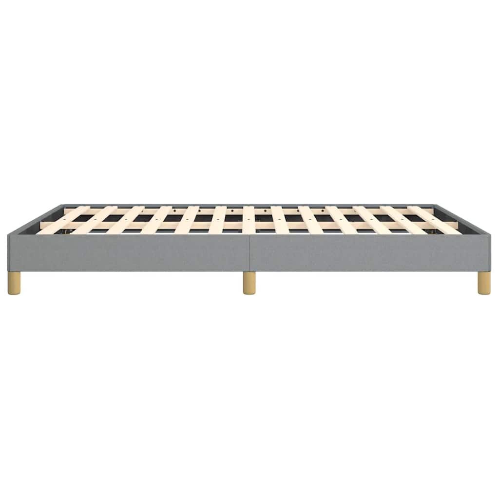 Grey upholstered platform bed frame with wooden slats