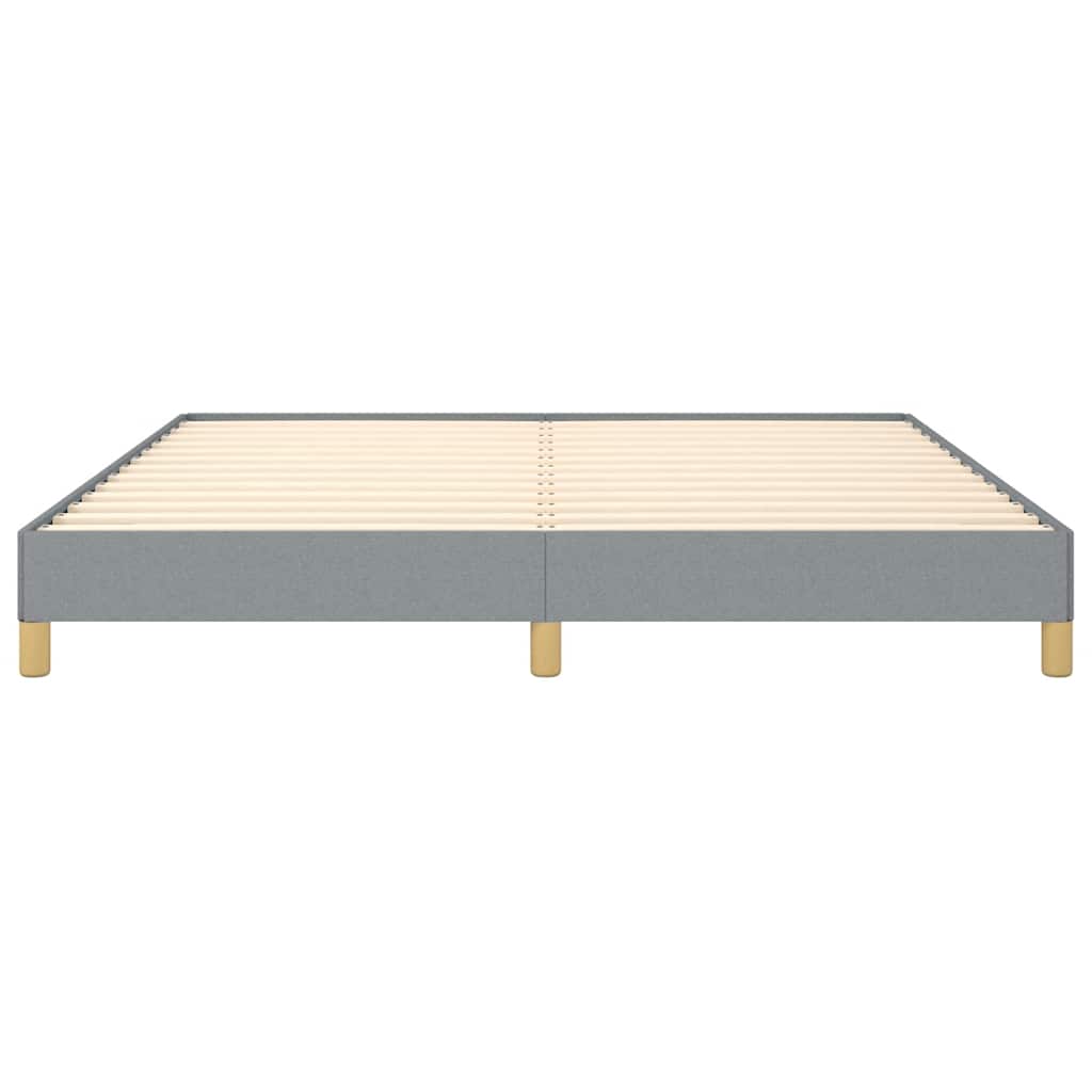 Grey upholstered bed frame with wooden slats and gold legs