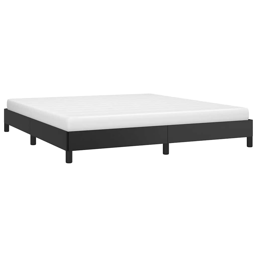 Modern black upholstered bed frame with white mattress