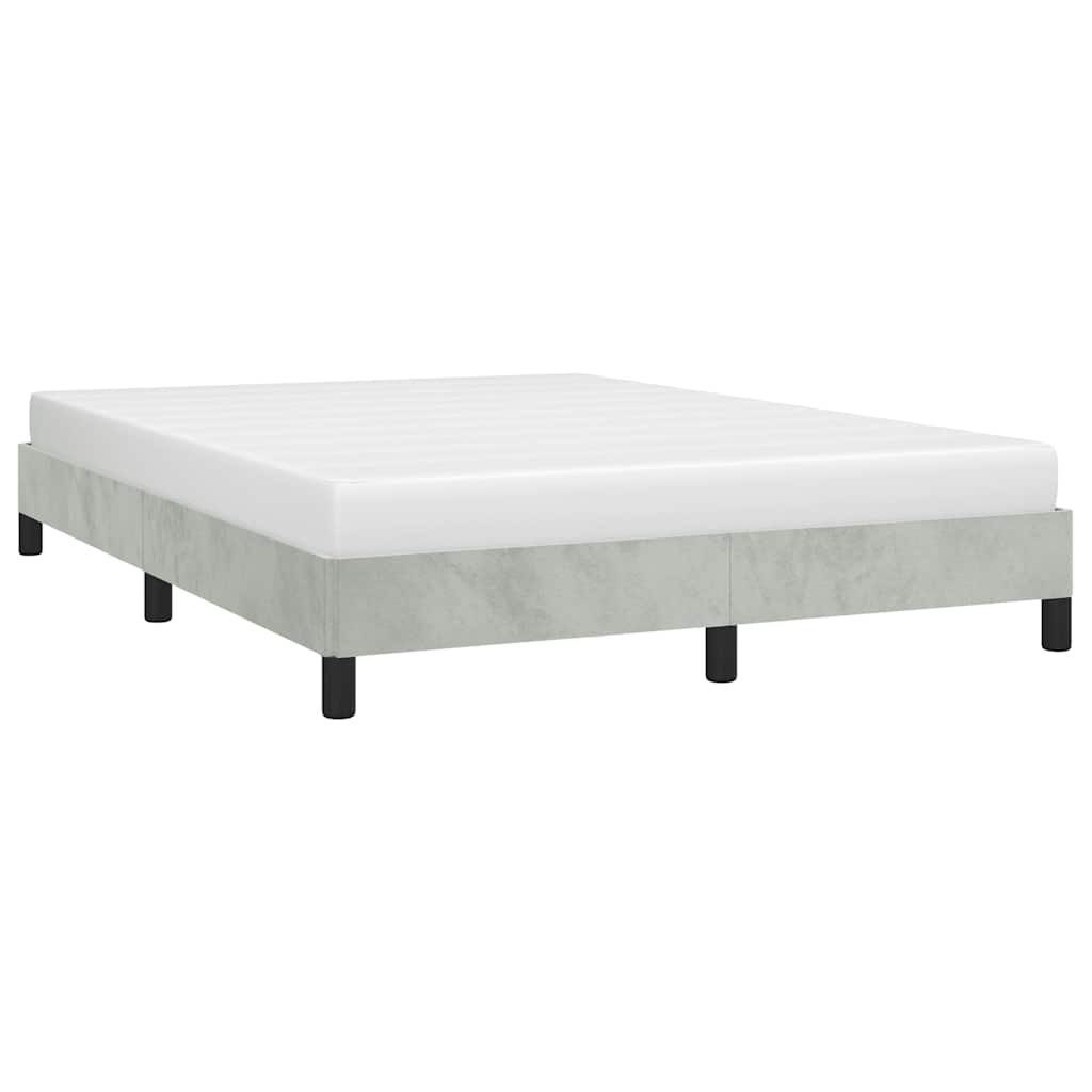 Modern gray upholstered bed frame with white mattress on black legs